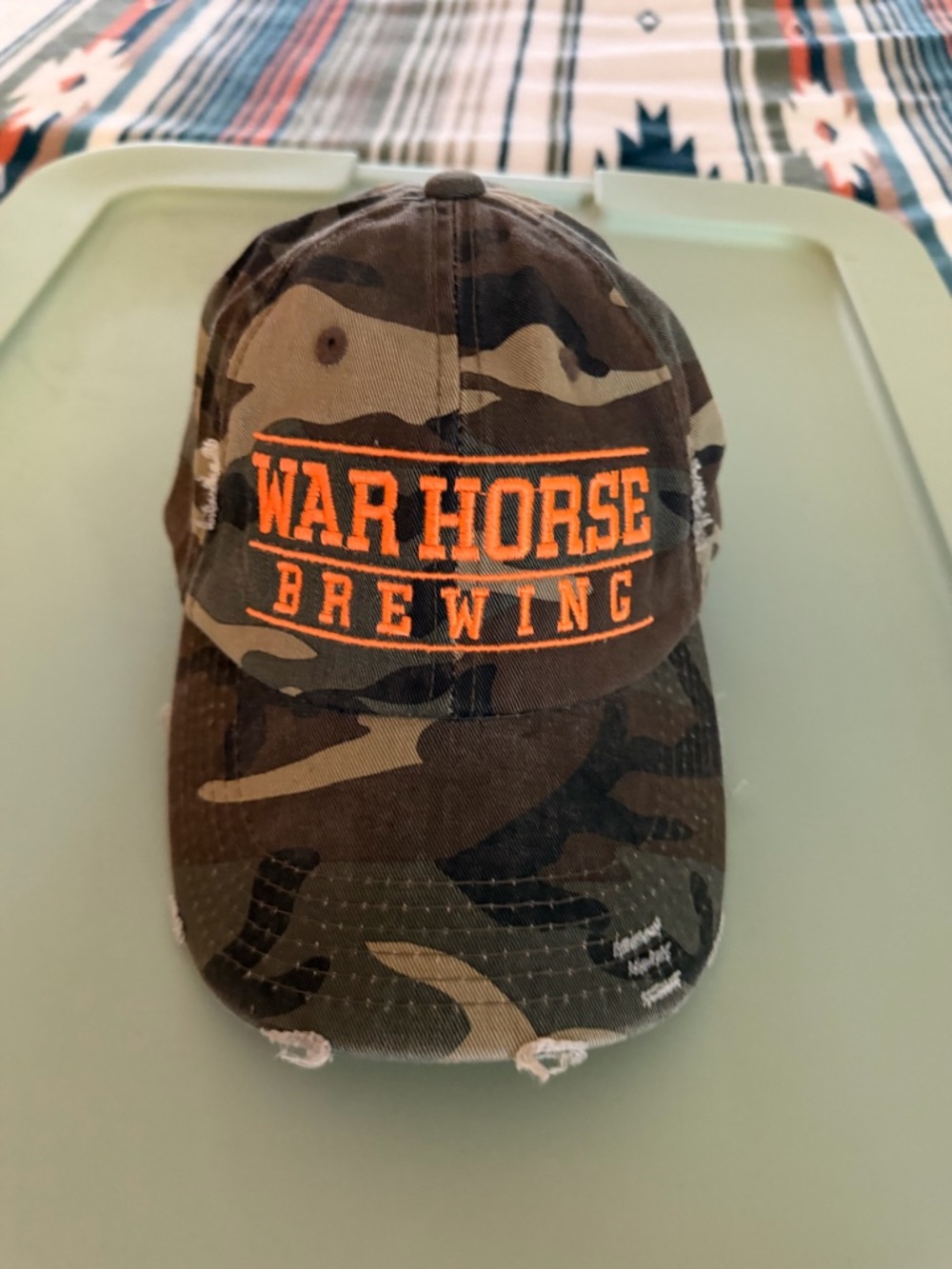 War Horse Brewing Camo Baseball Cap with Orange Logo